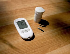 diabetes-medication-weight-loss. a thermometer, pills, and a bottle on a table